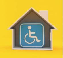 House with handicap space sign